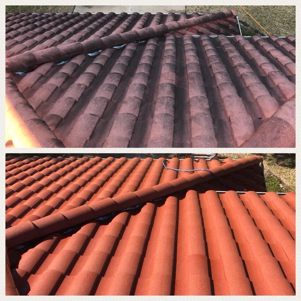 A worker applying a clear resin coating to a clean roof.